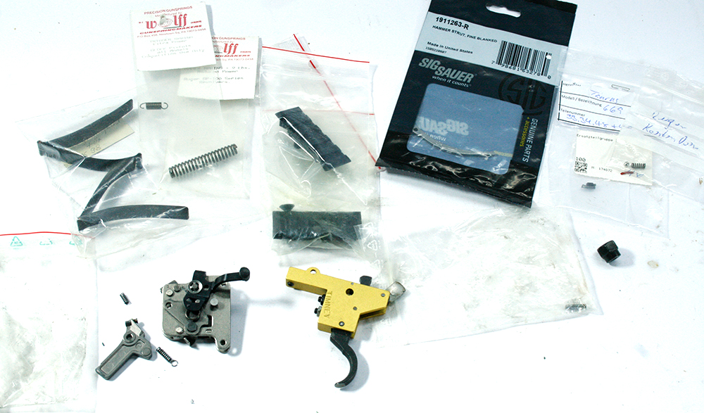 KONVOLUT-24_Diverse-Ersatzteile_Abzugsgruppen_TIMNEY_Federn_SigSauer_TAURUS_GLOCK_www.bayerwald-jagdcenter.de_0.jpg